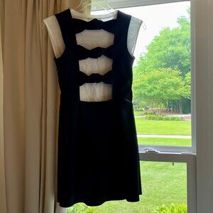 CUT-OUT BACK Mini Dress in Black. Tag says L, Fits like M